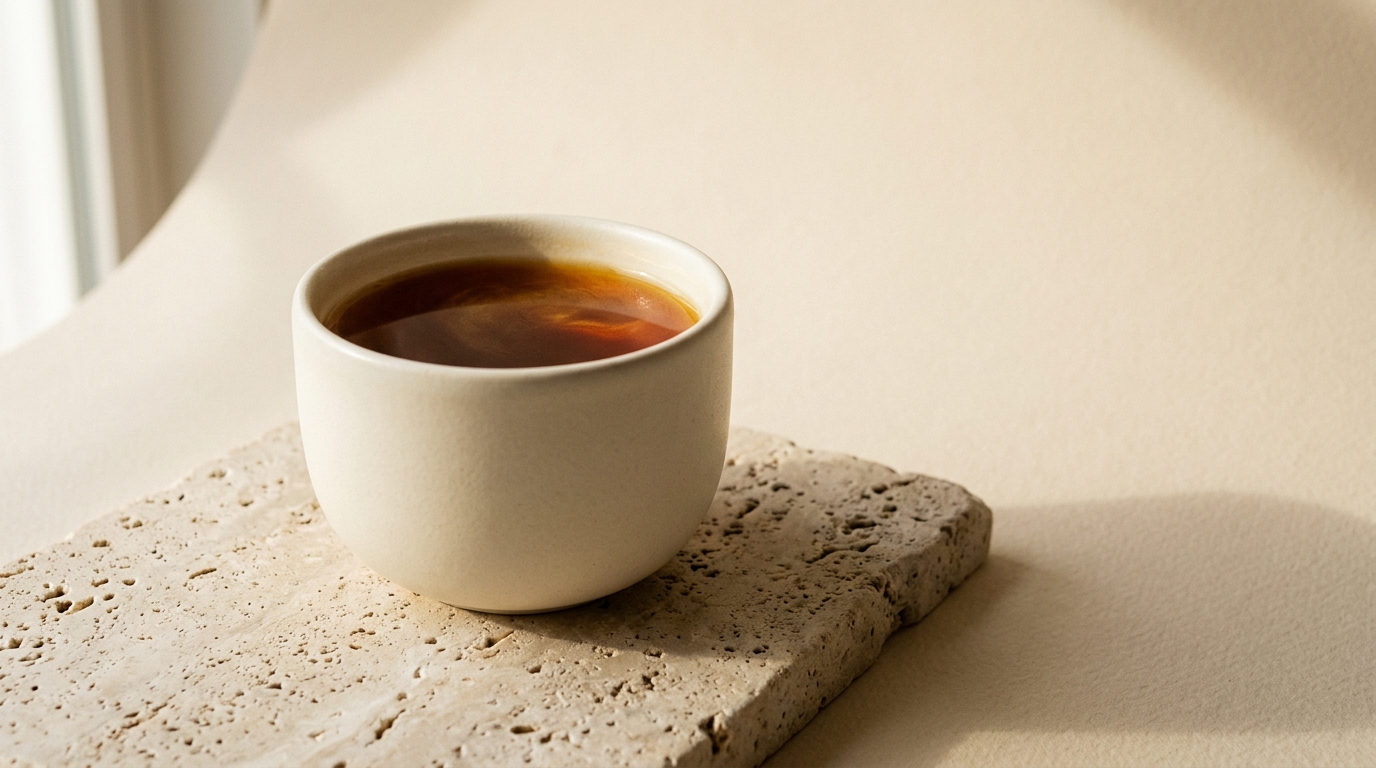 A warm cup of specialty coffee in natural window light